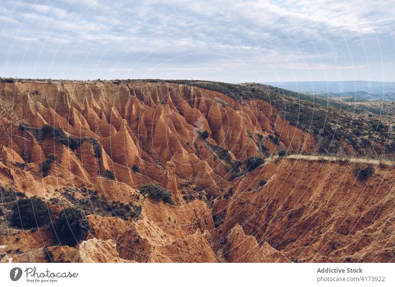 Geological formations with erosion in mountainous terrain rock sandstone uneven landscape geology nature highland rocky surface scenic scenery rough travel