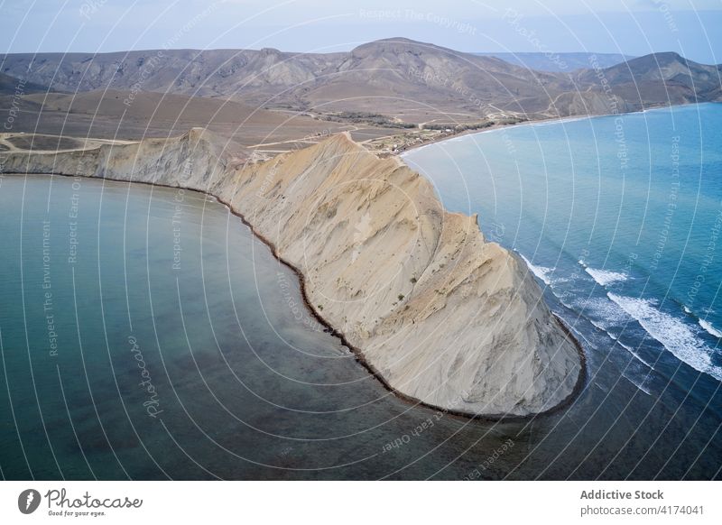 Rocky cape washed by sea water rocky coastline rough peninsula shore nature seascape shoreline seashore seaside travel tourism crimea russia stone landscape