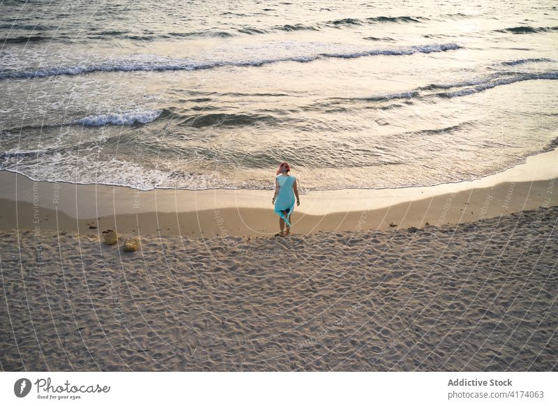 Woman admiring waving sea on beach woman wave sand fresh stormy alone seaside shore female travel tourism barefoot enjoy relax recreation breeze summer coast