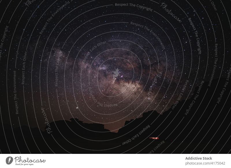 Amazing starry sky at night in mountains milky way galaxy twinkle glow astronomy universe wadi rum jordan silhouette shiny light cosmos nature constellation