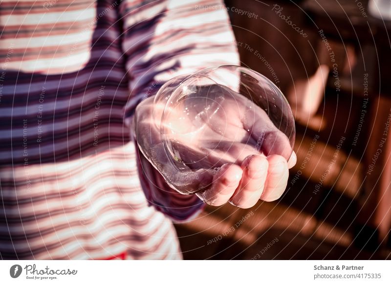 Child hand with soap bubble Hand Soap bubble Pyjama Stripe Striped dream dreams Dream shattered Dreams shatter Desire Wishes To hold on preserve watch Bursting