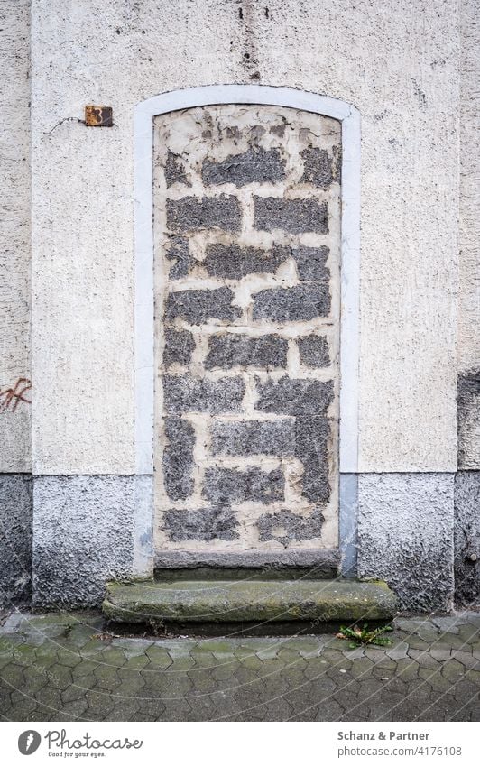 walled-up entrance Final Front door Entrance bricked up locked obstructed Barred Facade Passage Introverted depression Loneliness Lonely bricks Mortar stonewall