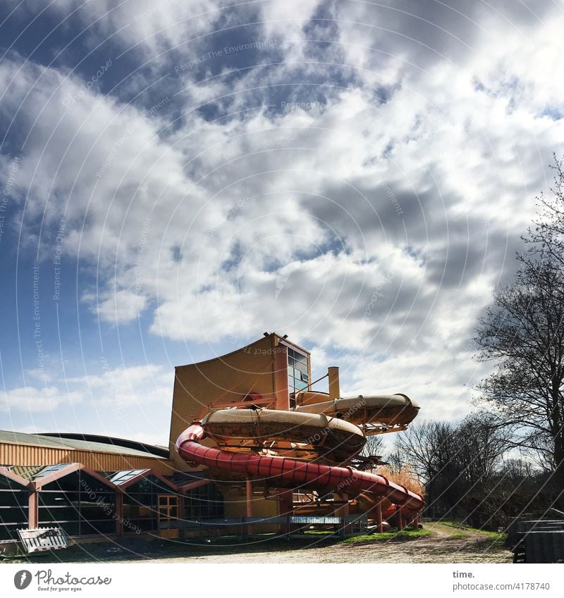 Round pieces House (Residential Structure) Facade sunny shady Tree Window Architecture Clouds Sky Slide Tower plant Closed free time Sports fun pleasure