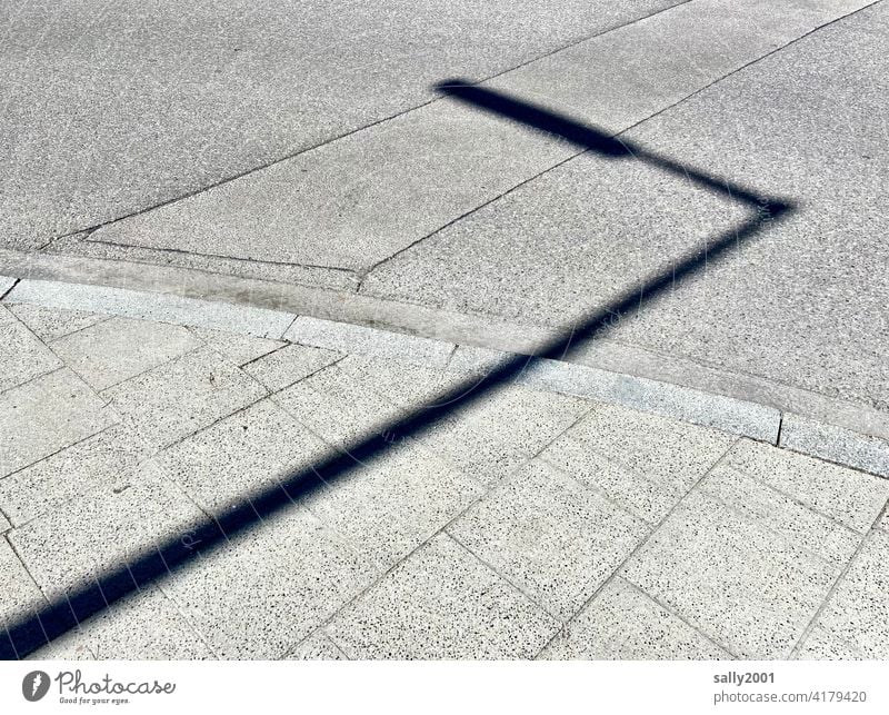 the shadow from the light... streetlamp street lamp Street Asphalt off Sidewalk Shadow shadow cast Sunlight Light Lanes & trails Deserted Pavement Gray