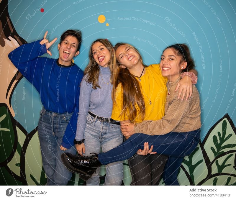 Group of smiling friends standing close women together optimist joy positive bonding enjoy glad female cheerful smile happy young relationship girlfriend