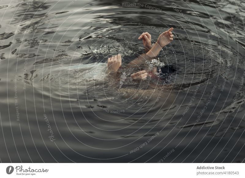 Unrecognizable woman with partner swimming in rippled lake tourist arms raised relationship travel enjoy spend time idyllic circle traveler gentle tender