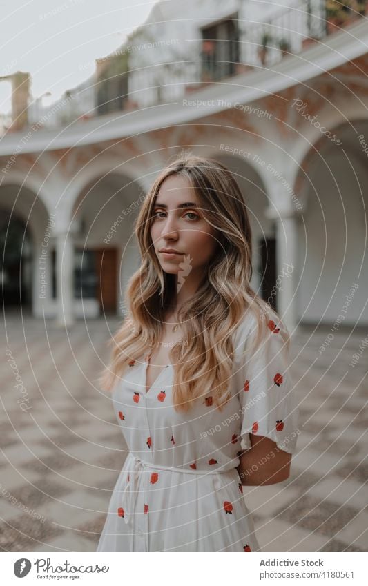 Dreamy traveler against old building in town vacation trip dreamy gentle lifestyle architecture ornament woman city contemplate ponder idyllic wistful pavement