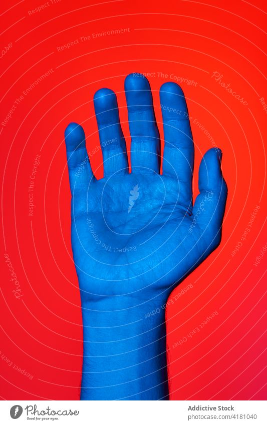 Man's hand with open palm over red background man adult wrist isolated person finger communicate five human skin volunteer vote gesturing hi male message bid