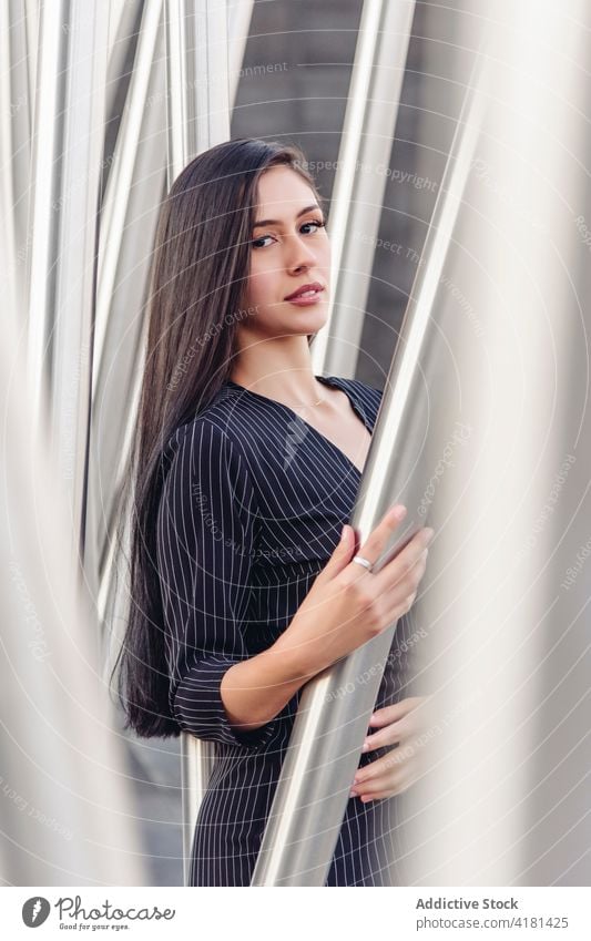 Elegant businesswoman in stylish suit looking at camera style elegant confident young brunette modern fashion classy lifestyle trendy long hair female