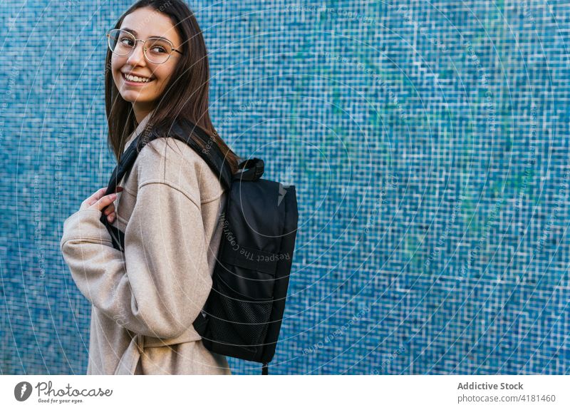 Crop smiling female student with backpack on street woman toothy smile positive optimist glad happy rucksack cheerful content stand pretty charming charismatic