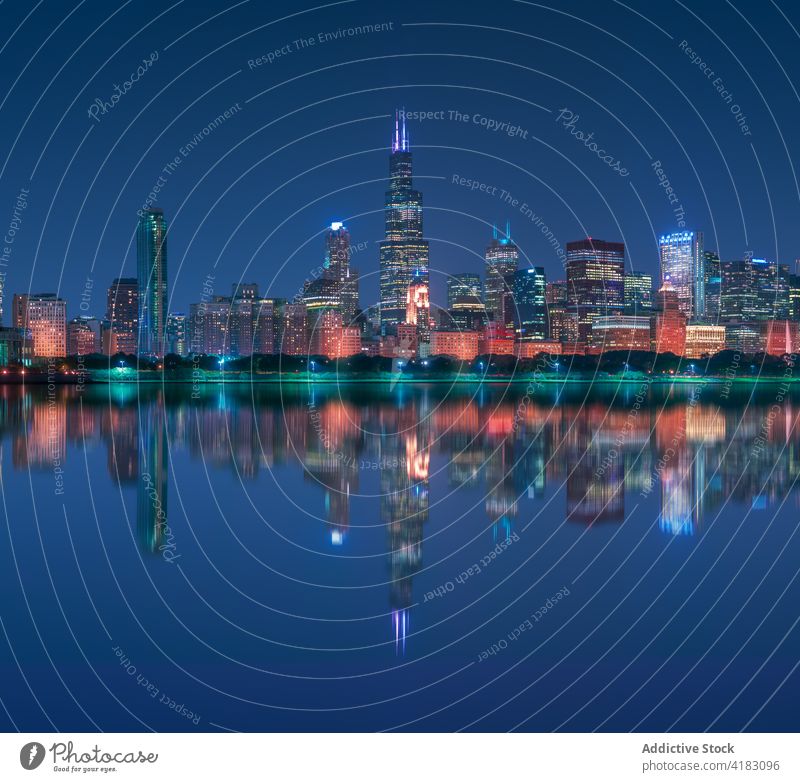 Modern city embankment with skyscrapers at night cityscape urban architecture contemporary reflection building modern chicago usa united states america lake