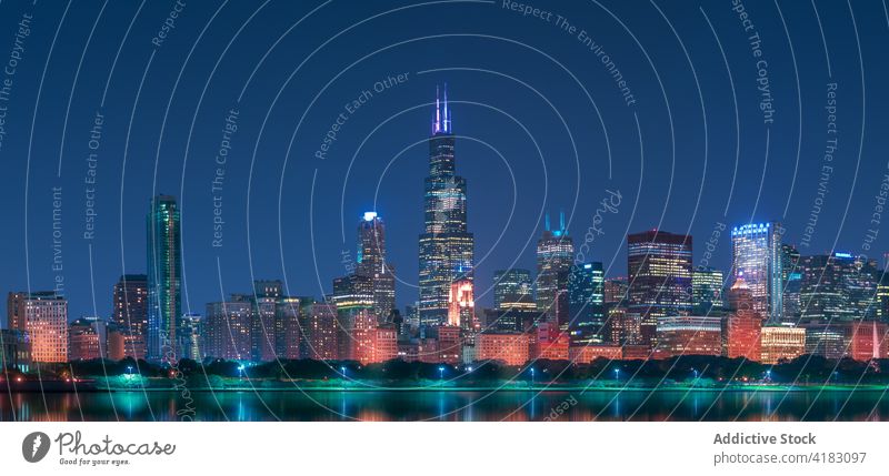 Modern city embankment with skyscrapers at night cityscape urban architecture contemporary reflection building modern chicago usa united states america lake