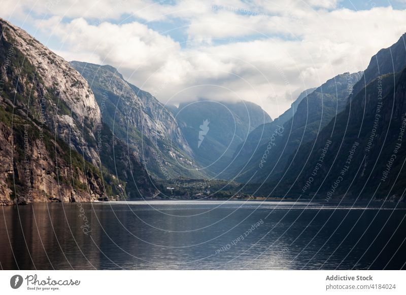 Calm lake in mountains landscape picturesque smooth water calm scenery norway surface terrain daylight highland serene breathtaking spectacular nature sky