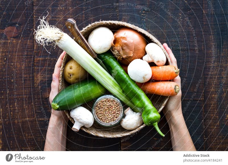 Basket of organic vegetables and grain cereal basket full assorted vegan vegetarian abundance wicker harvest nutrition ingredient leek onion pepper mushroom