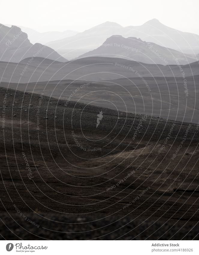 Scenic hills in misty overcast highlands hillside haze fog nature gloomy tranquil skyline terrain landscape rocky scenic spacious horizon morning peaceful