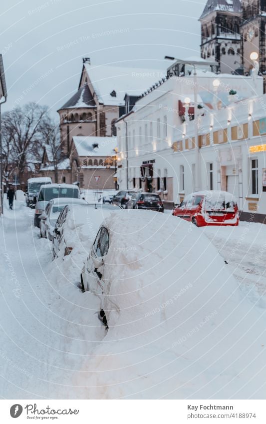 parked cars covered with snow blizzard city climate climatic cold conditions extreme freeze frost frozen ice nature outdoor parking parking space problem scene