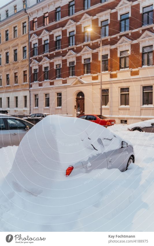 parked cars covered with snow blizzard city climate climatic cold conditions extreme freeze frost frozen ice nature outdoor parking parking space problem scene