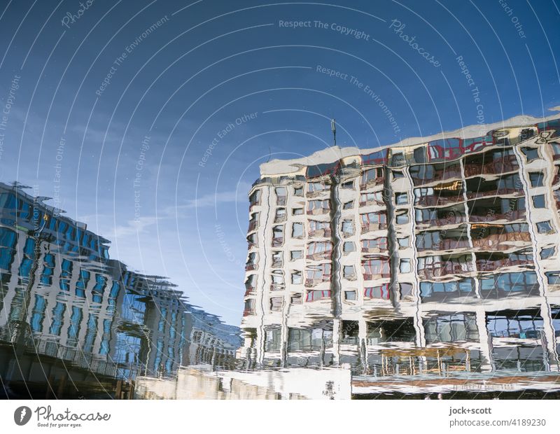 blurred houses on the quiet river Spree River Calm Architecture Cloudless sky Downtown Berlin blurriness sunshine hazy Reflection Surface of water Facade