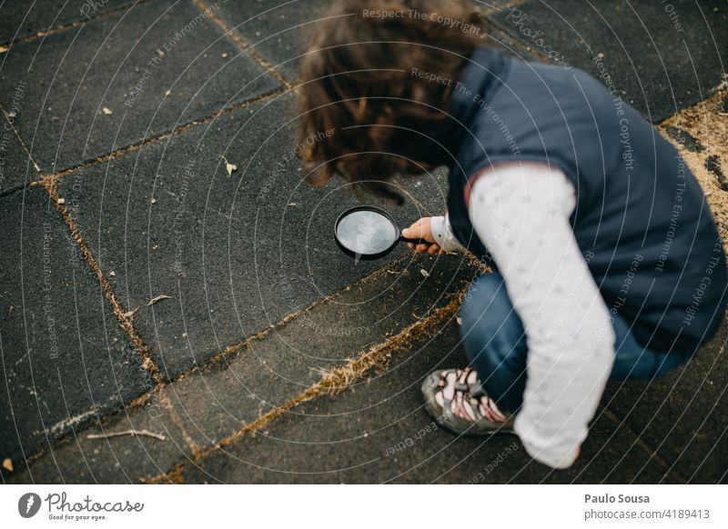 Child explore with magnifying glass Magnifying glass Girl 1 - 3 years Caucasian Ant Happy Curiosity Lifestyle Exterior shot Human being Nature Joy Playing