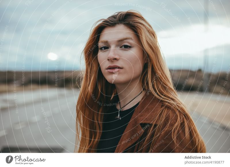 Stylish calm lady looking at camera on street woman confident style rest appearance personality tranquil street style city fashion female young long hair