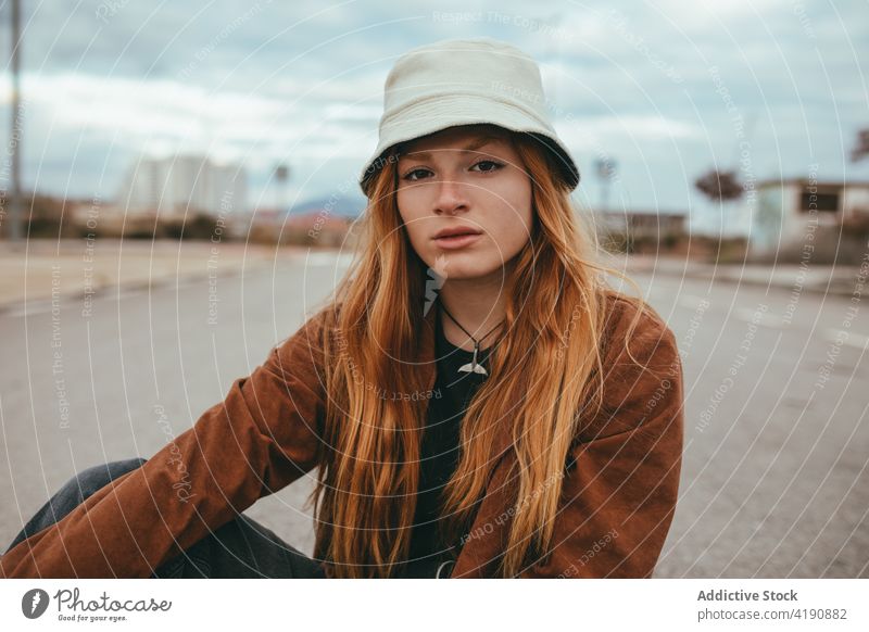 Stylish calm lady looking at camera on street woman confident style rest appearance personality tranquil street style city fashion female young long hair