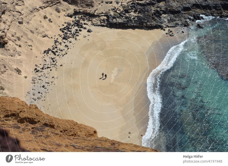 Two people at a sandy bay by the sea seen from far above Beach Ocean Bay Sand Water coast Landscape Nature Vacation & Travel Tourism Loneliness togetherness