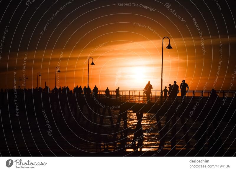 A special evening spectacle or spectacle, on the pier that takes place almost every evening. A few figures on the pier do not miss it. Sunset Ocean Evening