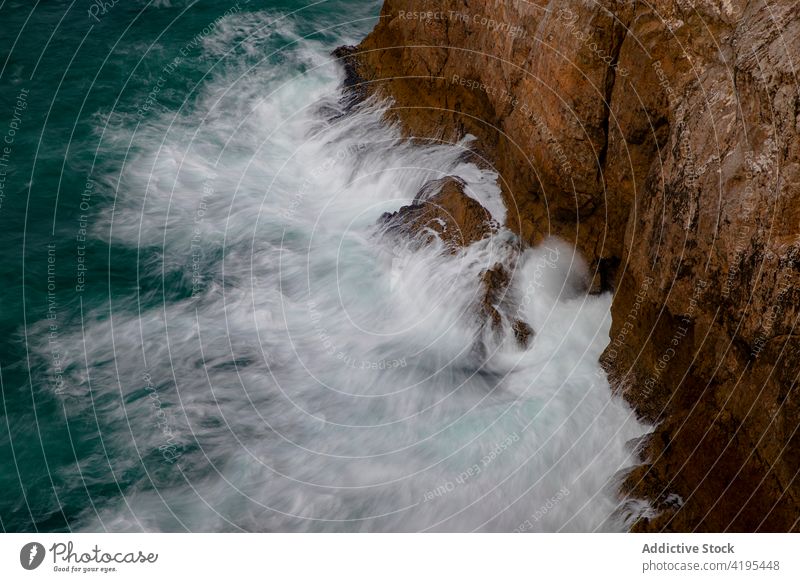 Stormy sea near rough headland in daytime ocean foam nature highland energy dramatic fast flow dynamic fluid wavy cabo de sao vicente portugal algarve region