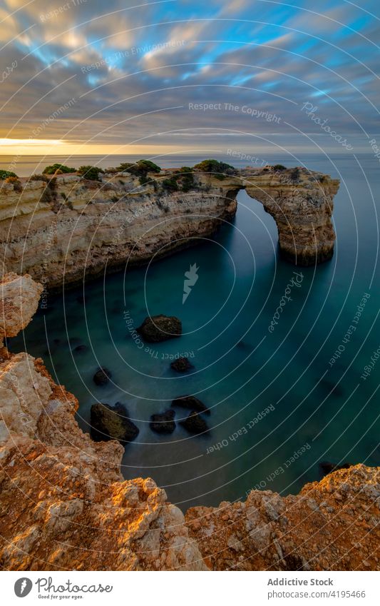 Massive rocks in the seaside at sunset nature landscape highland ocean massive majestic sundown picturesque formation portugal region algarve town scenic