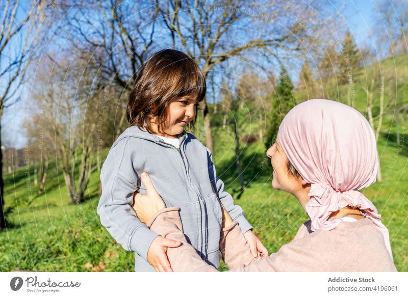 Sick mother standing with daughter in park woman together cancer love relationship summer happy disease parent smile relax concept pink little girl family child