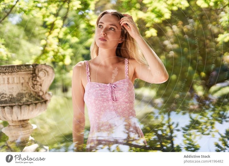 Pensive teen woman in green park teenage delight individuality female tree charming summertime adolescent young dress madrid europe spain foliage plant youth