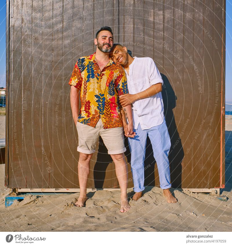 a gay couple at the beach in a sunny day love lgtb 25-29 Years Couple - Relationship Passion Leisure Activity Sharing African-American Ethnicity Happiness