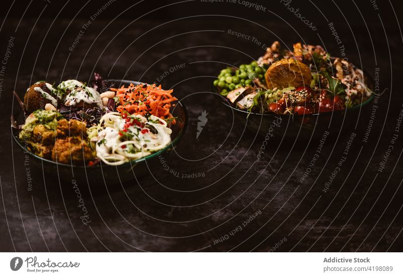 Assorted delicious vegan food on table in restaurant menu vegetarian lunch meal dinner gastronomy gourmet assorted wooden dish mushroom sauteed tasty vegetable