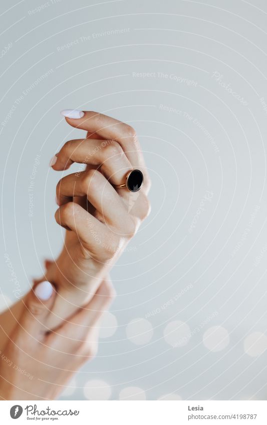 Decoration on hand. Hand part of the body details hands Rest relaxed Touch Body decorations ring on hand Skin subject shooting wall macro details pastel