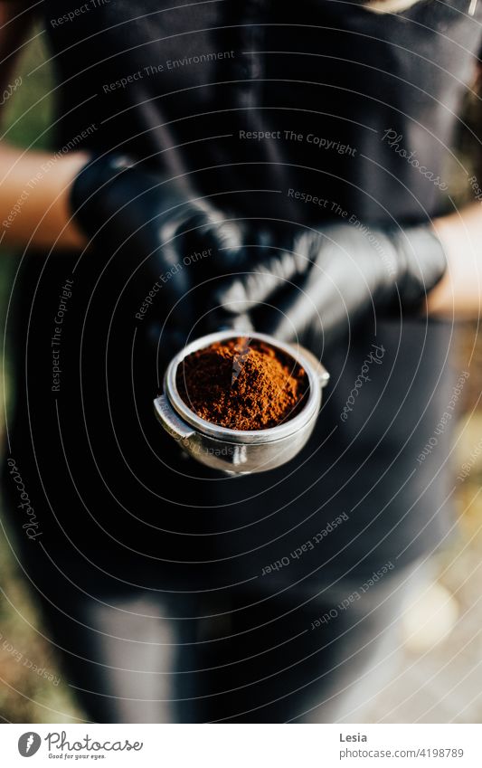 Ground coffee. Coffee in grains fragrant black coffee Coffee grounds arabica Café ground coffee coffee beans hot coffee Espresso coffee in hands coffee machine