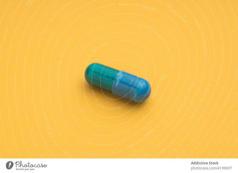 Plastic capsule of medical drug for treatment medication pharmaceutical care dose heal prescription concept chemistry studio shot colorful chemical health care