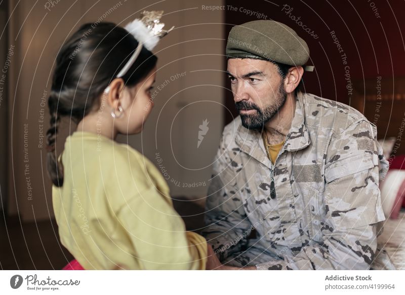 Soldier talking to daughter before going to war father military holding hands defend patriot soldier army man girl uniform security conflict force defense