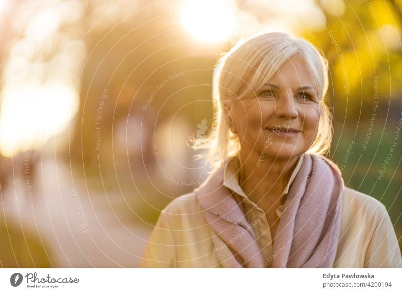 Senior woman outdoors senior people mature retired elderly old retiree pensioners one person retirement gray hair caucasian beautiful adult attractive enjoying