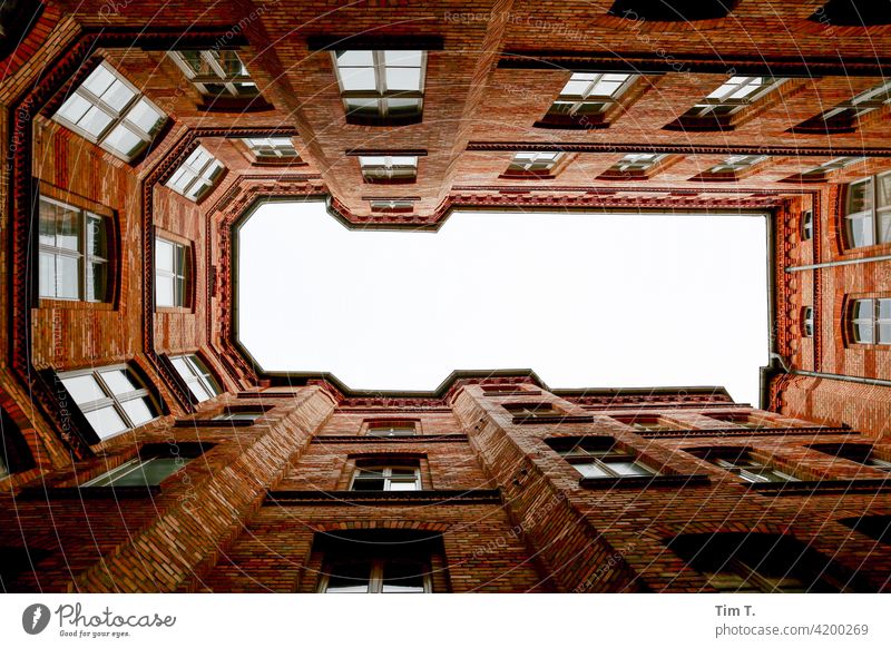 View upwards in a courtyard of the university Courtyard Upward Backyard old buildings Deserted Berlin Middle House (Residential Structure) Town Downtown Window