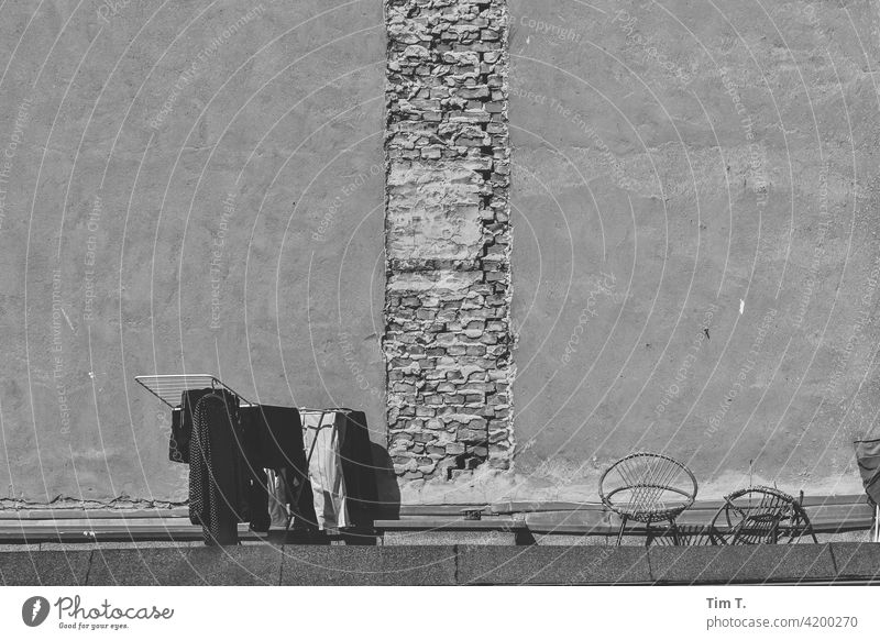 a tumble dryer with laundry stands on a roof in a backyard in Berlin Backyard Prenzlauer Berg Dry Laundry Courtyard b/w Roof Facade Tumble dryer Deserted Town