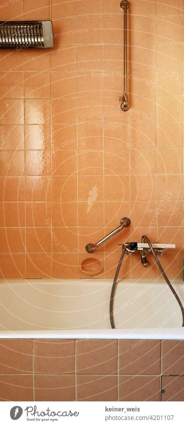 Old bathroom in orange with electric heater and faucet with shower head Orange Tile Bathroom Living or residing Bathtub Deserted Colour photo Flat (apartment)