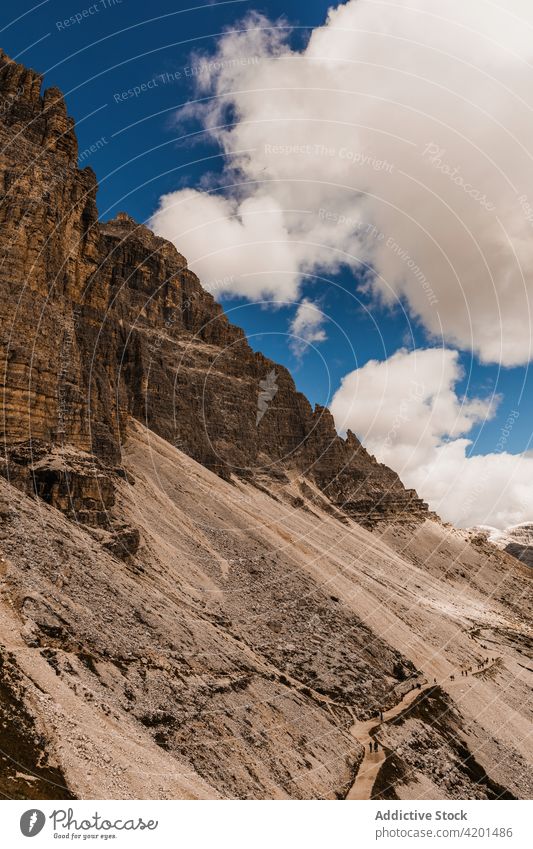 Mountain ridge under blue cloudy sky mountain rock peak landscape range rough highland nature scenery rocky italy dolomites alps alpine majestic scenic