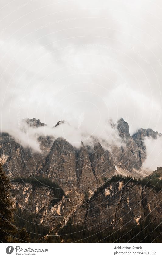 Mountain range with mist under cloudy sky mountain fog nature highland landscape geology atmosphere magnificent massive scenic rough scenery barren terrain