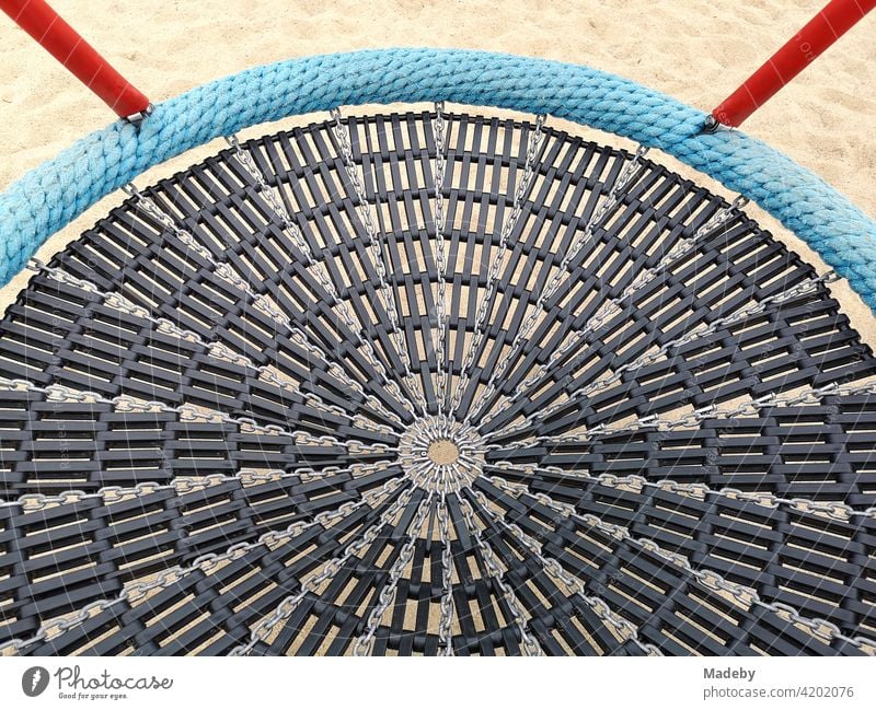 Round swing seat with rubber net at a modern children's playground at the harbour in Offenbach am Main in Hesse Swing Rocking basket Rocking Nest Swing net