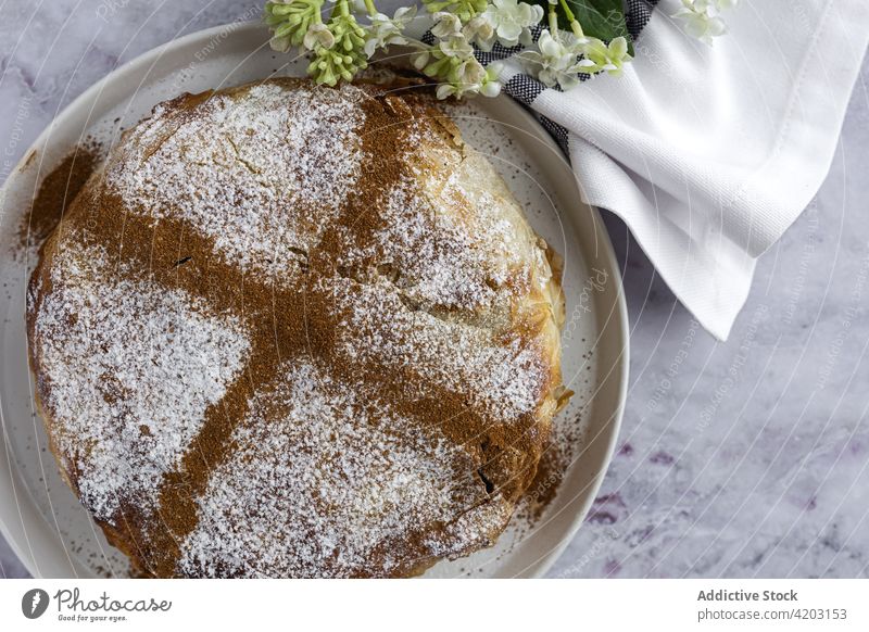 Delicious moroccan pastilla with cinnamon powder on plate cake moroccan food arabic food dinner lunch spice ramadan holiday dry aromatic seasoning chicken