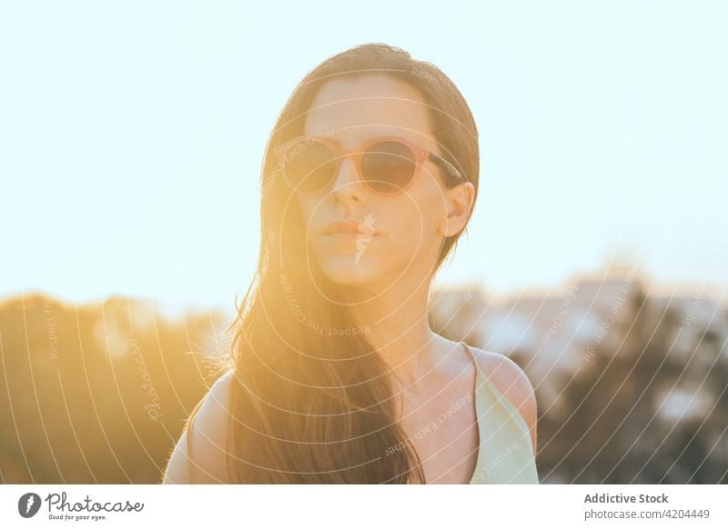 Stylish woman in sunglasses enjoying summer day style trendy confident fashion eyeglasses sunny female long hair lifestyle young modern urban personality