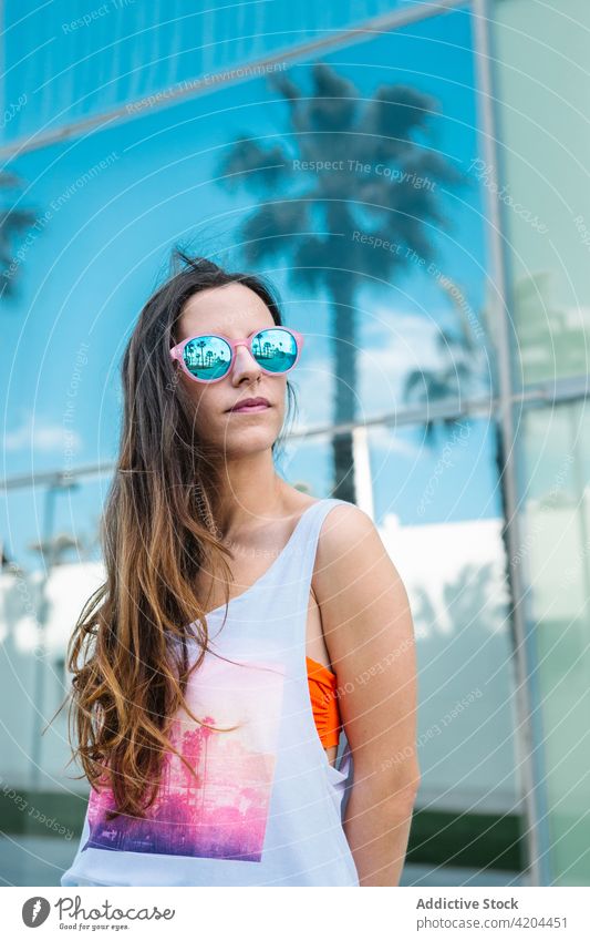 Stylish woman in sunglasses enjoying summer day style trendy confident fashion eyeglasses sunny female long hair lifestyle young modern urban personality