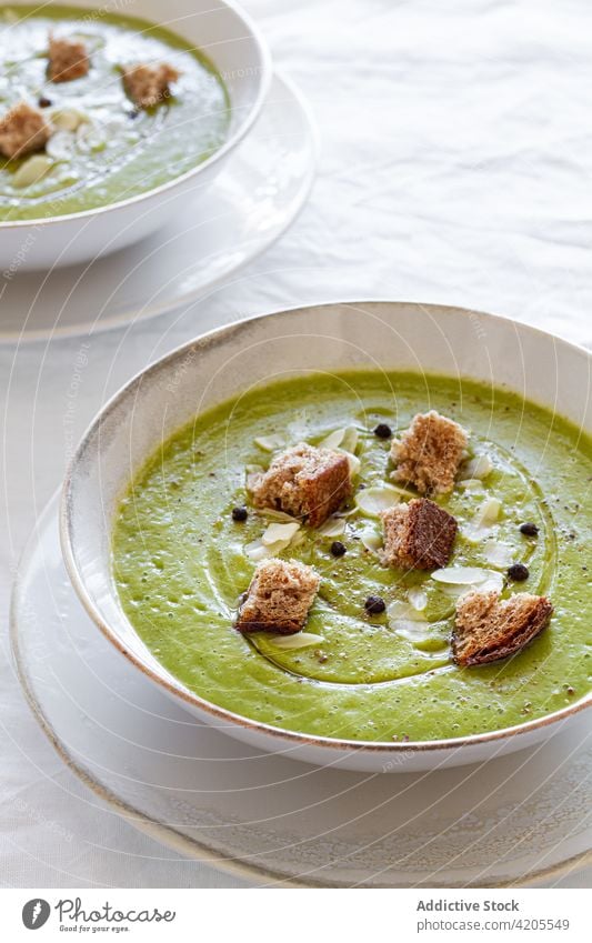 Bowl with tasty zucchini cream soup on table serve bowl crouton meal food lunch dish home portion delicious palatable delectable cuisine fresh organic