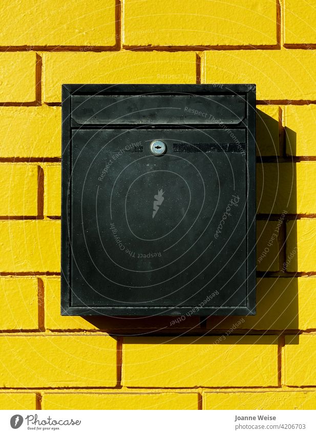 Yellow brick wall with black mailbox. yellow wall Brick wall Mailbox shadows colourful Exterior shot Day daytime Bright Colours Wall (building) Colour photo