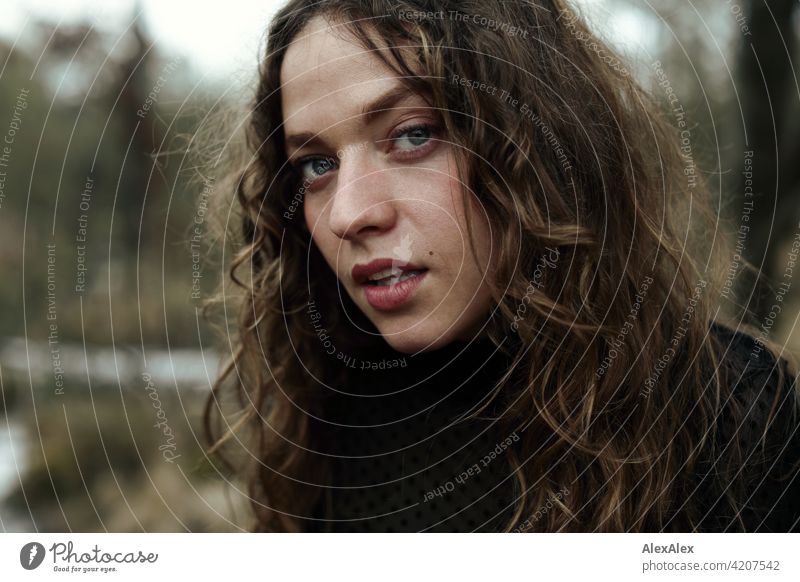 Portrait of a young woman with long, brunette, curly hair in front of a moor landscape Woman Young woman 18 - 30 years pretty Beauty & Beauty long hairs Curl